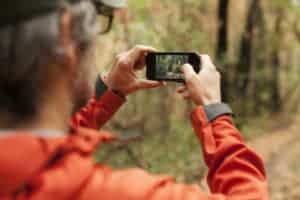 man taking picture with phone