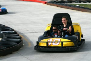 people riding a go kart