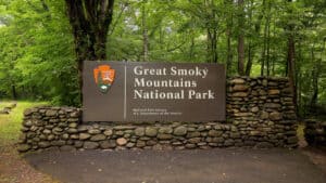 An entrance sign welcomes visitors to Great Smoky Mountains National Park.